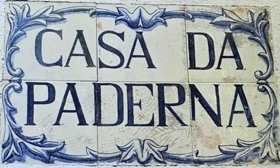 The hand-painted blue-and-white azulejo panel beside the front door, lettered “Casa da Paderna”.